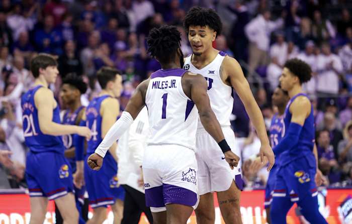 Mar 1, 2022; Fort Worth, Texas, USA; TCU Horned Frogs guard Mike Miles (1) and TCU Horned Frogs guard Micah Peavy (0) celebrate during the second half against the Kansas Jayhawks at Ed and Rae Schollmaier Arena. Mandatory Credit: Kevin Jairaj-USA TODAY Sports